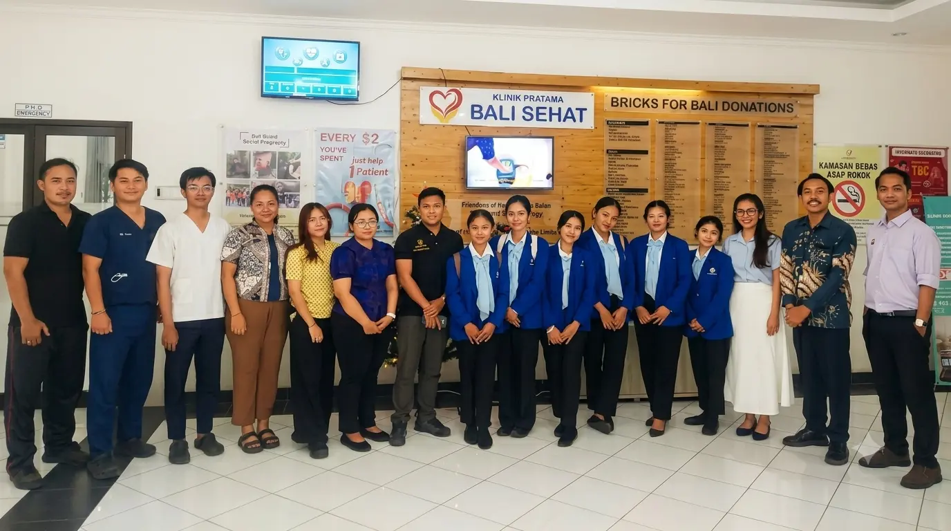 Bali Sehat Clinic staff and Alfa Prima Karangasem on-job training students posing together in the clinic lobby