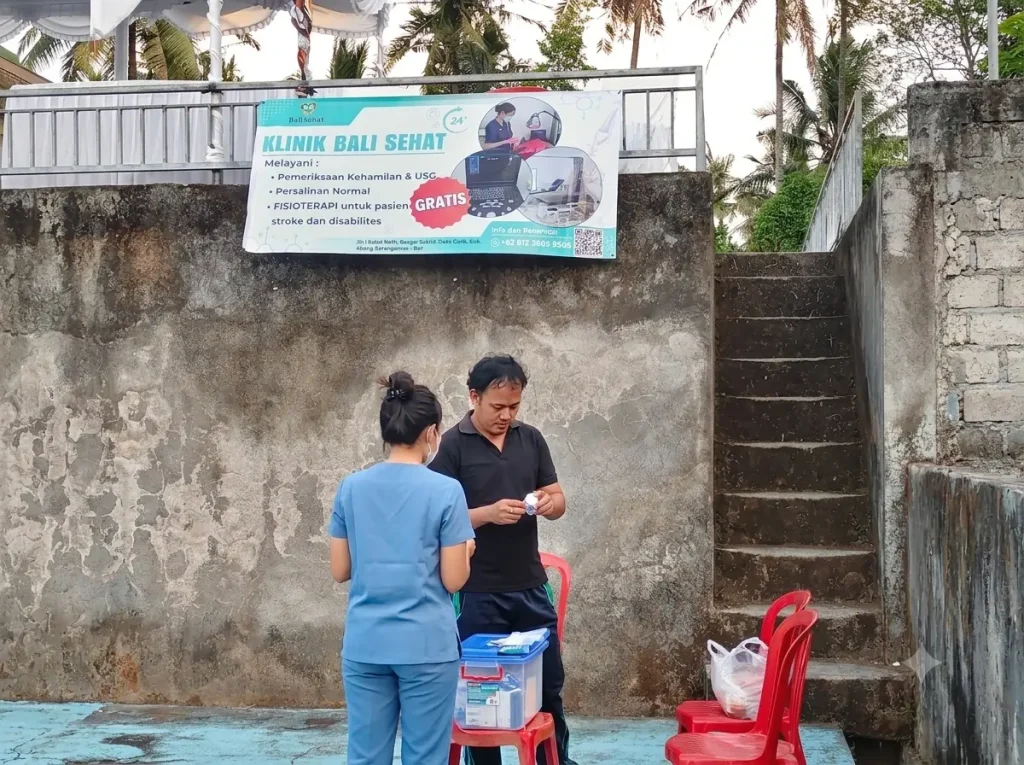Bali Sehat Clinic staff setting up a health support post near the PORDES Desa Culik 2026 sports venue