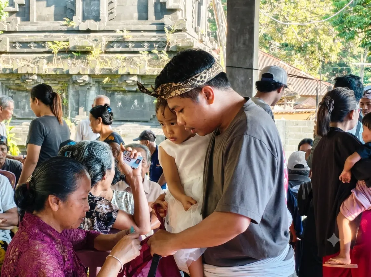 A Balinese father carrying his daughter while registering for free health services at Healthy Day in Desa Kesimpar