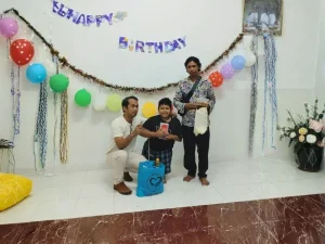 Child with disability in Bali celebrating birthday with Bali Sehat team